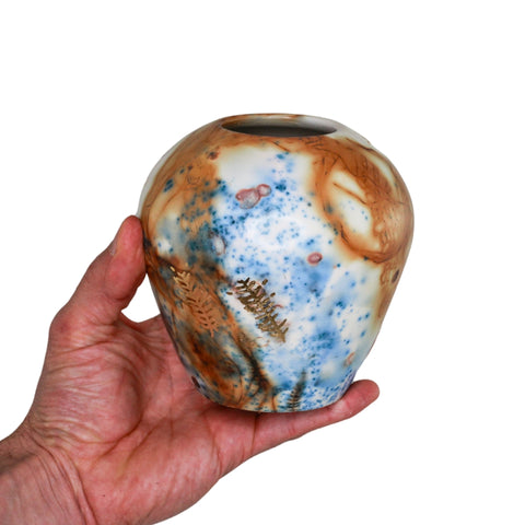 Saggar fired vase with gold leaf
